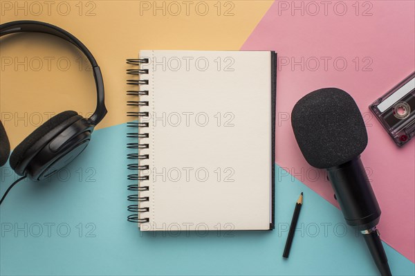 Copy space notepad with mic headphones