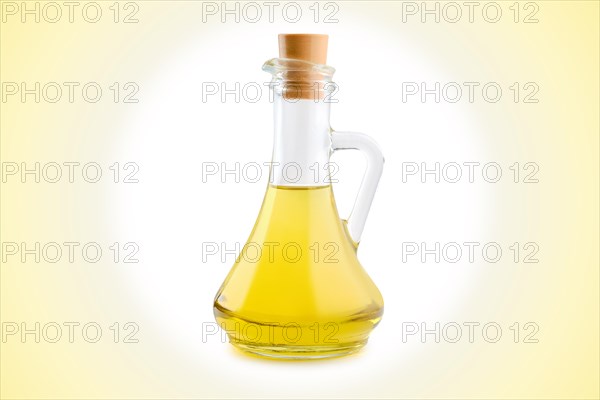 Jar with vegetable oil on circular gradient background