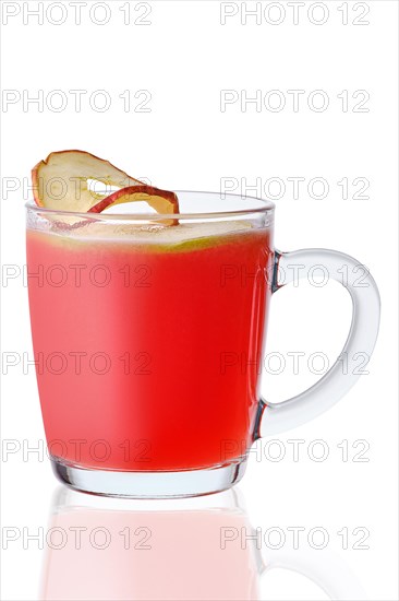 Glass of hot apple and cranberry drink isolated on white background
