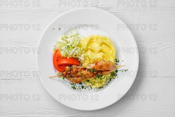 Top view of plate with chicken shashlik