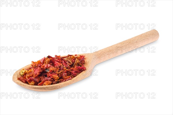 Wooden spoon with pepper isolated on white