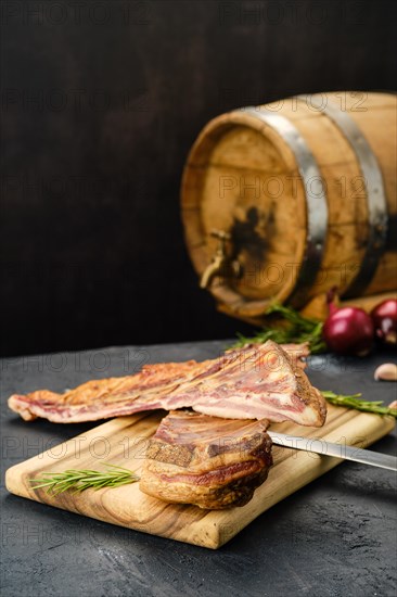 Air dried lamb ribs on wooden cutting board