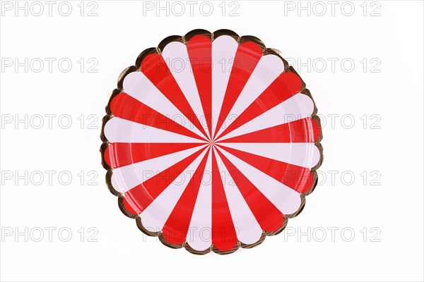 Red and white striped party paper plate isolated on white background