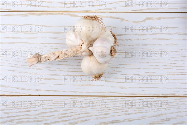 Cloves of garlic placed on a wooden texture