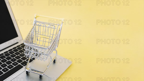 Small cart on laptop. Resolution and high quality beautiful photo