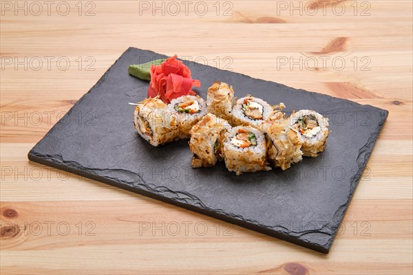 Rolls with tuna and avocado on slate plate