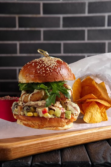 Bacon burger on wooden plate