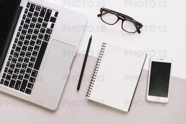 Notepad glasses laptop smartphone