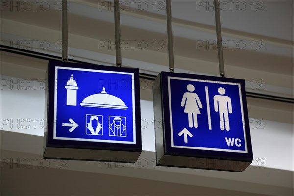 Signs for mosque and toilets in the City Centre Doha