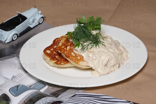 Pancakes with mushroom and onion sauce