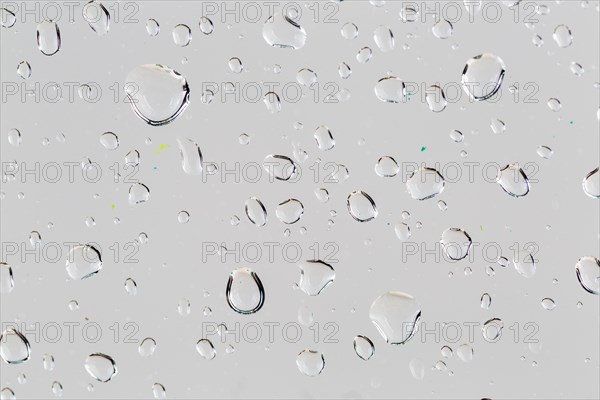 Close up droplets white surface