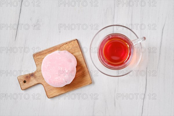 Top view of sweet dessert mochi with strawberry with fruit tea