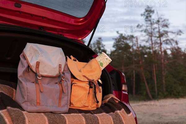 Couple backpacks trunk with copy space