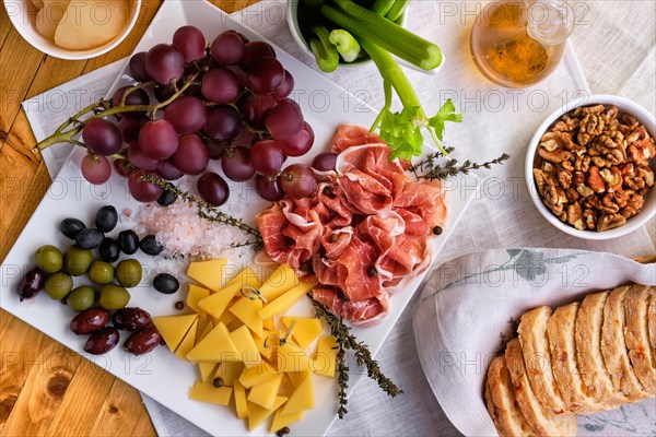 Overhead view of set of various appetizers for wine