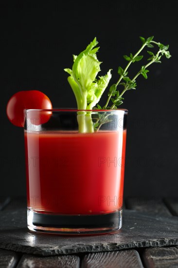 Cocktail Bloody Mary on dark wooden background