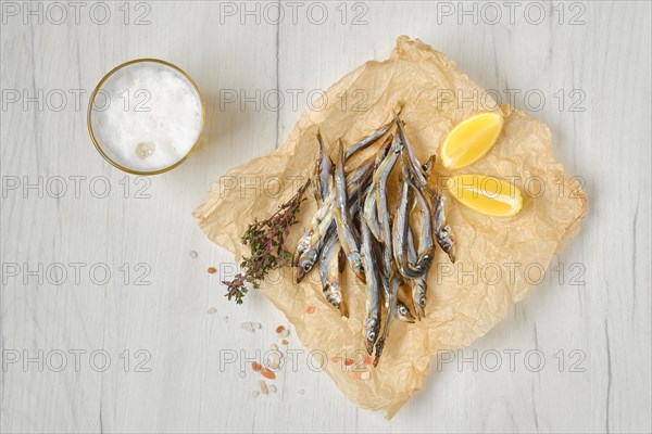 Top view of smoked smelt in wrapping paper