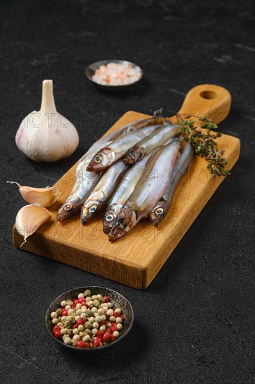 Pile of fresh raw frozen capelin