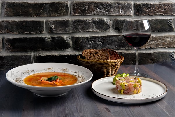 Traditional lunch with salmon soup and herring tartar