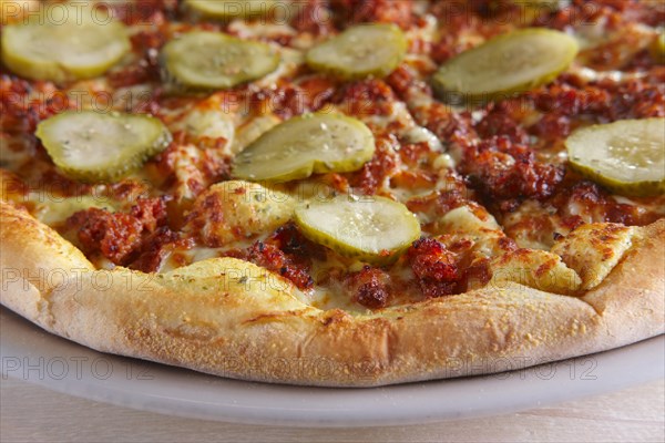 Double cheese pizza with pickled cucumber