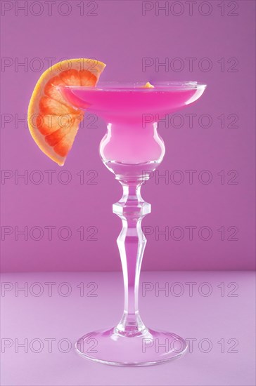 Viola cocktail on purple background