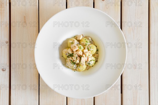 Top view of potato dumplings with boiled chicken meat