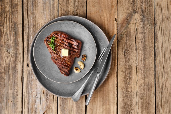 Overhead view of beef steak on a plate