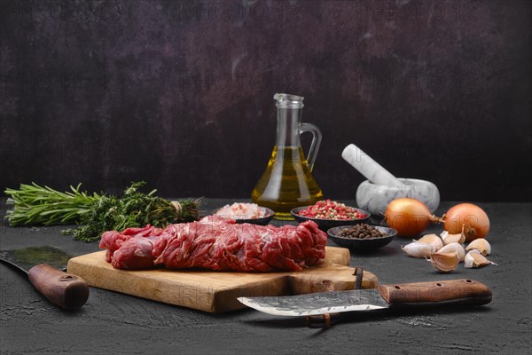 Raw fresh lamb boneless neck meat on cutting board