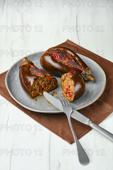 Aubergine filled with meat baked in oven