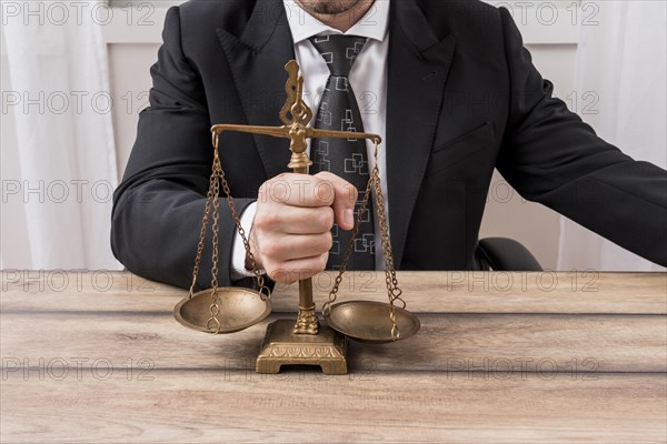 Lawyer with weighing scales