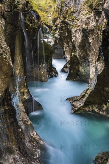 Mountain river Soca flows through narrow canyon