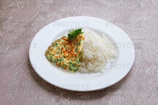 Fried hake fillet with spinach