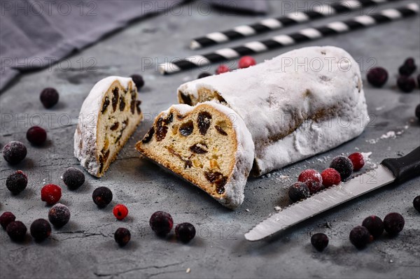 Slice of traditional German christmas season sweet food called Stollen or Christstollen