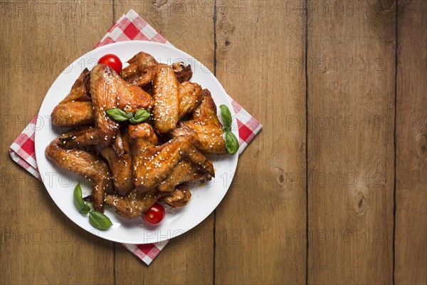 Top view chicken wings plate with sesame seeds copy space. Resolution and high quality beautiful photo