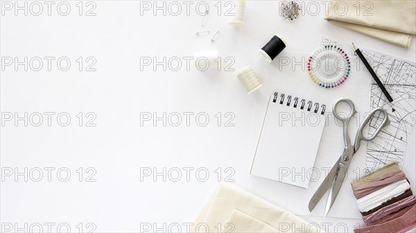 Top view sewing essentials with textiles copy space. Resolution and high quality beautiful photo