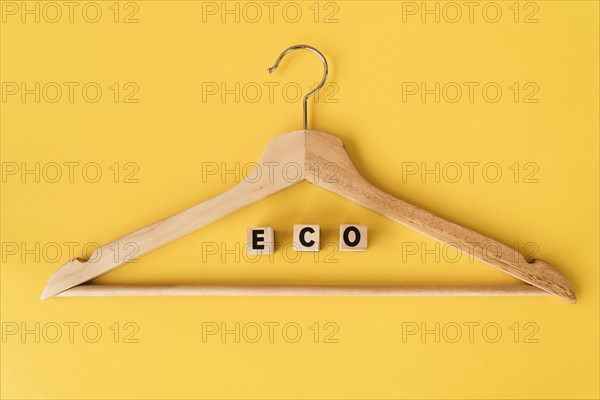 Top view wooden hanger with yellow background 1. Resolution and high quality beautiful photo