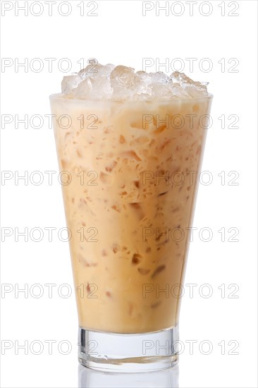 Milkshake with triple chocolate in tall transparent glass isolated on white background