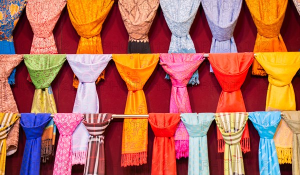 Pile of bright Multi-colored pieces of fabric in a bazaar