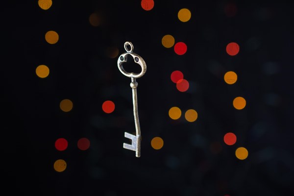 Retro style key on a bokeh light background