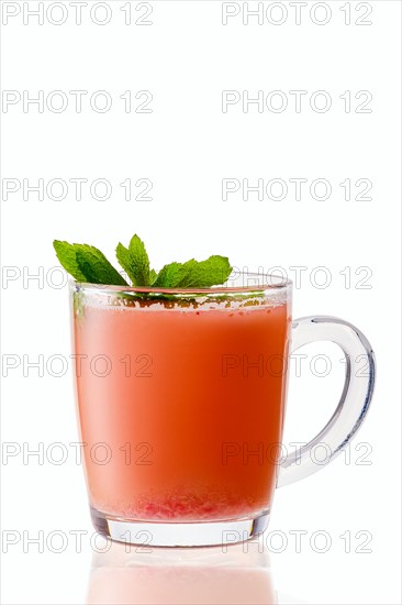 Hot strawberry winter drink with anise and mint