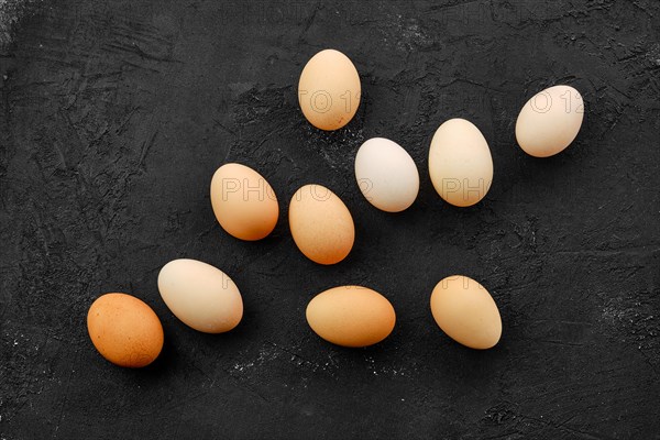 Fresh country eggs scattered on table