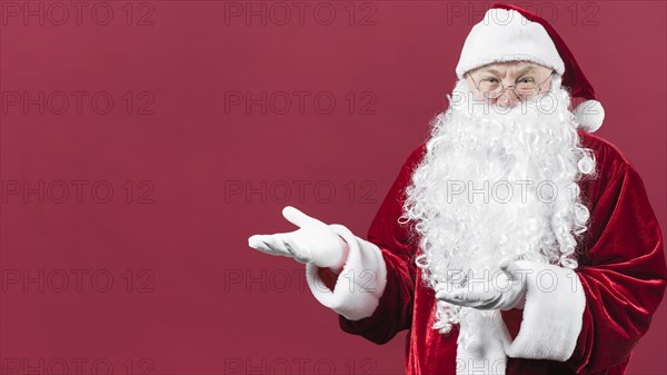 Santa claus showing something with hands. Resolution and high quality beautiful photo
