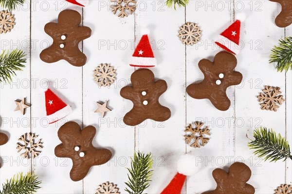 German gingerbread in shape of men glazed with chocolate between Christmas decoration