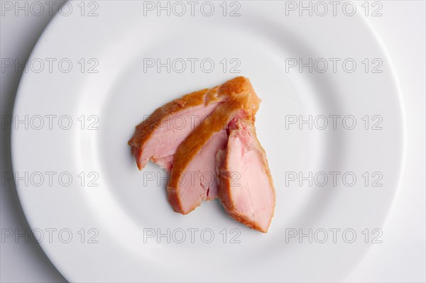 Top view of slices of ham on a plate