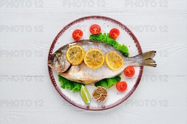 Overhead view of gilt head bream baked in oven