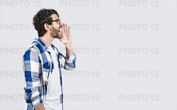 Handsome bearded man yelling and announcing a promotion