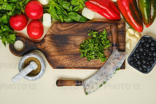 Top view of mezzaluna and ffresh vegetables
