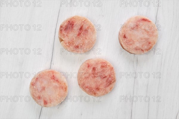 Frozen round fish cutlet for burger or frying