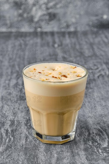 Raf coffee in facetted glass on shabby background