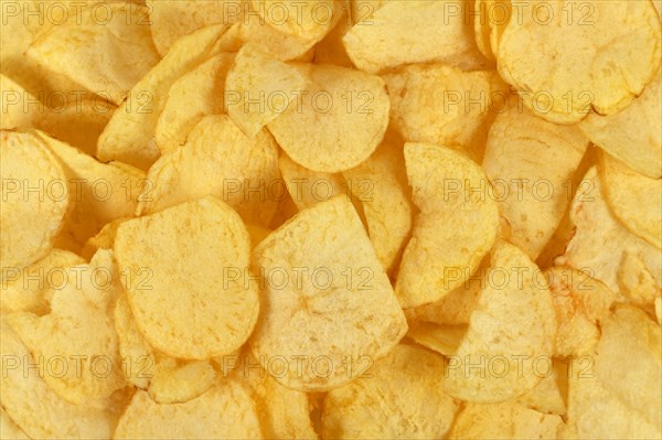 Top view of golden thin potato chips
