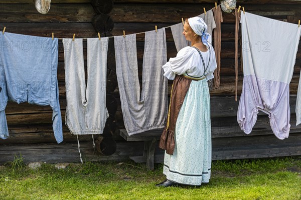 Traditionla dressed women doing hand washing